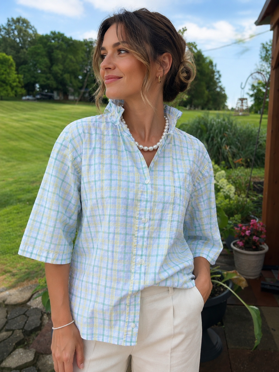 White blouse with soft shades of pale yellow and green.