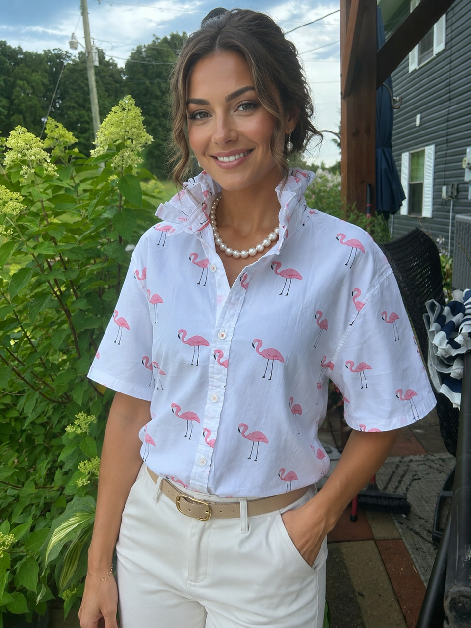 Playful pink flamingo print with a signature ruffled collar