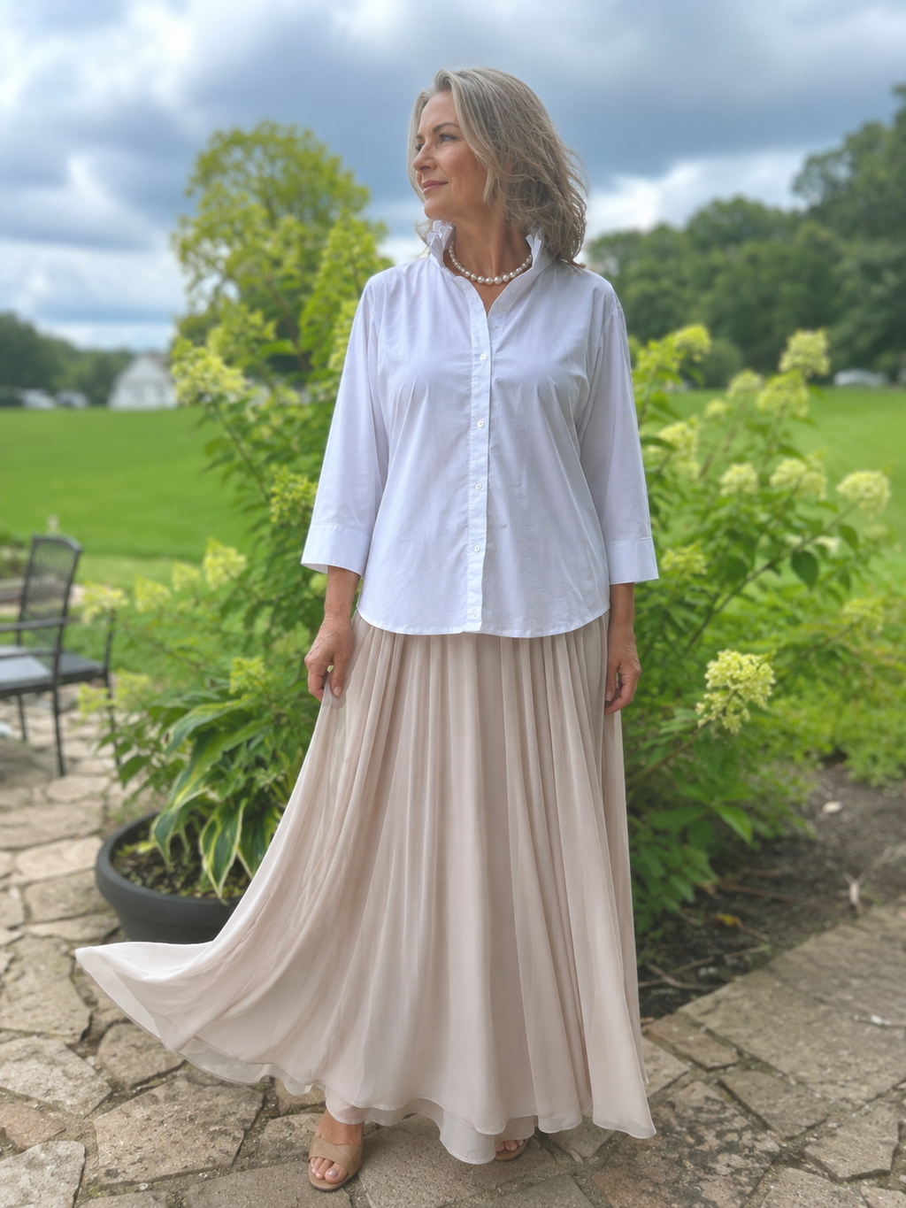 Crisp white cotton blouse with a feminine ruffled stand collar.
