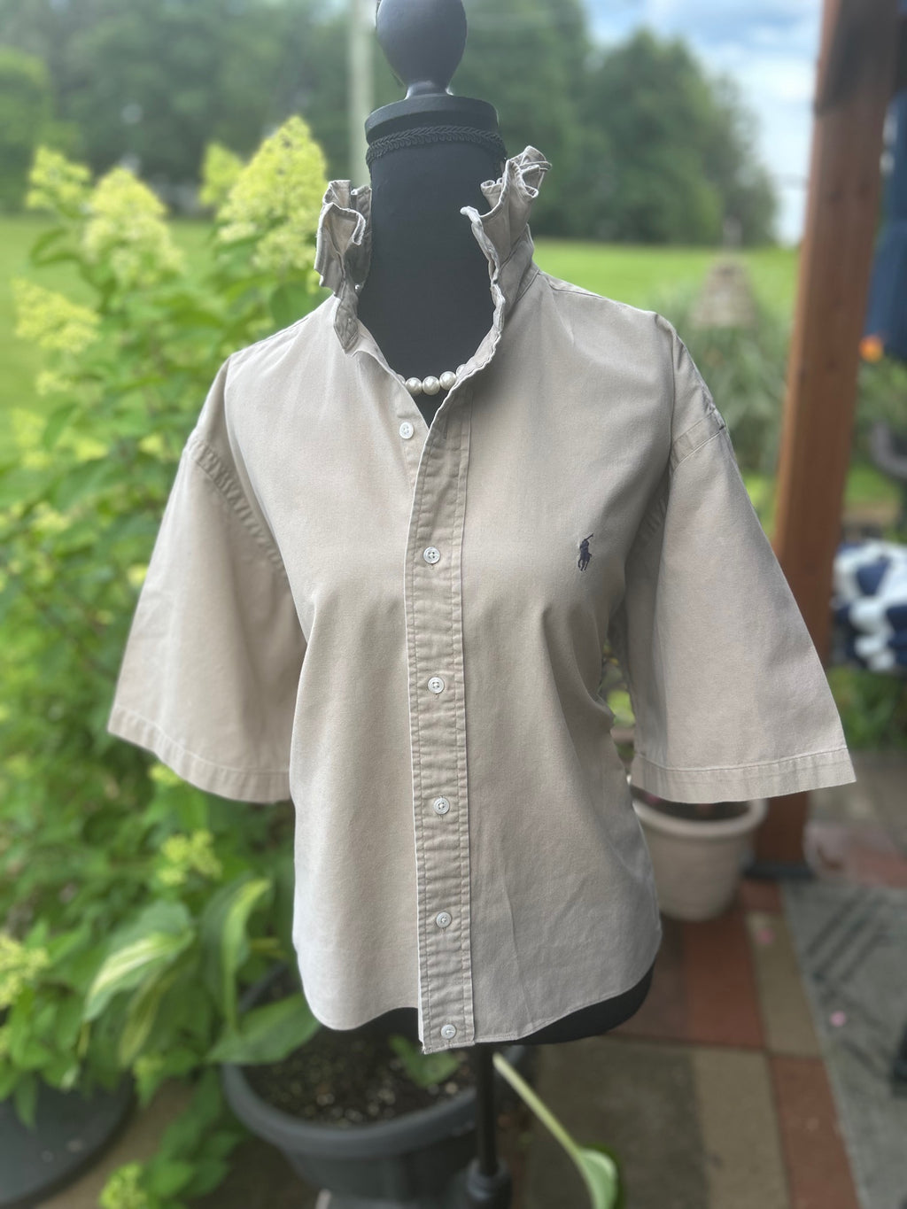 Classic short sleeve button-down with elevated feminine ruffled collar
