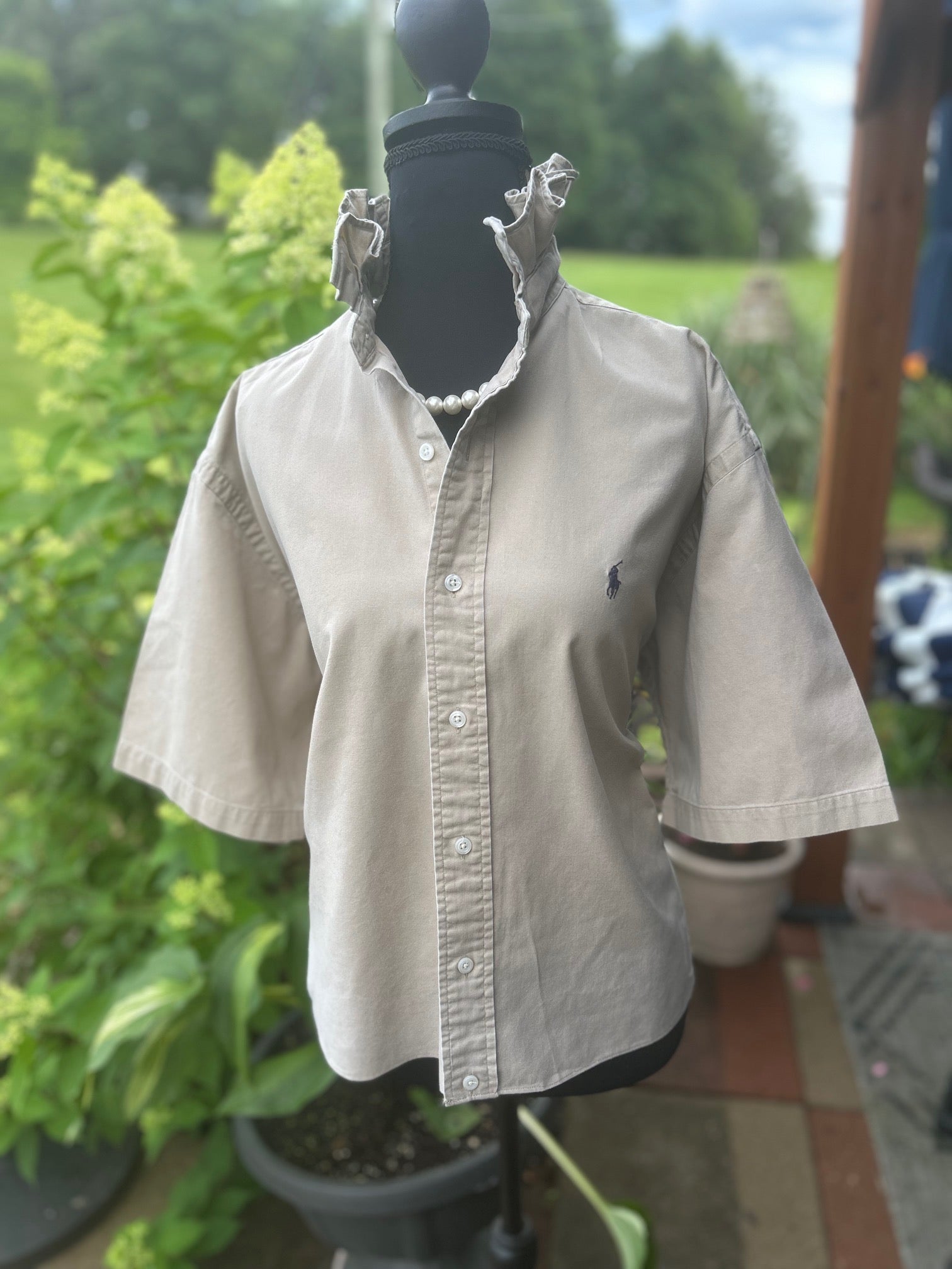 Classic short sleeve button-down with elevated feminine ruffled collar