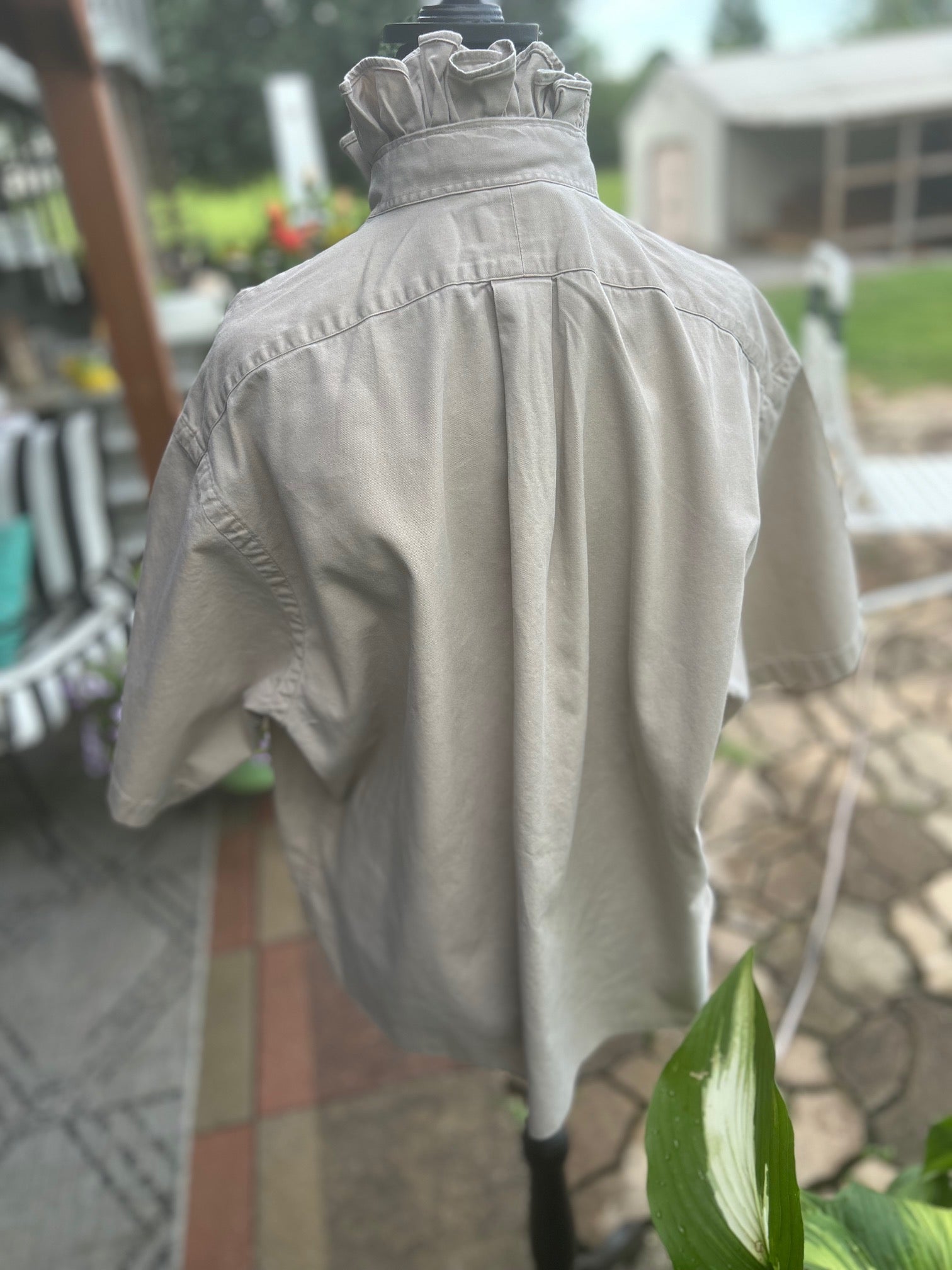 Classic short sleeve button-down with elevated feminine ruffled collar