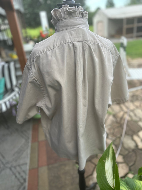 Classic short sleeve button-down with elevated feminine ruffled collar